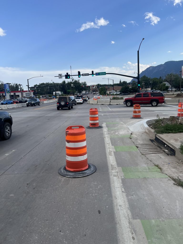 Barriers blocking Tejon St sidewalk and bike lane south of I25 ramp and Motor Way
